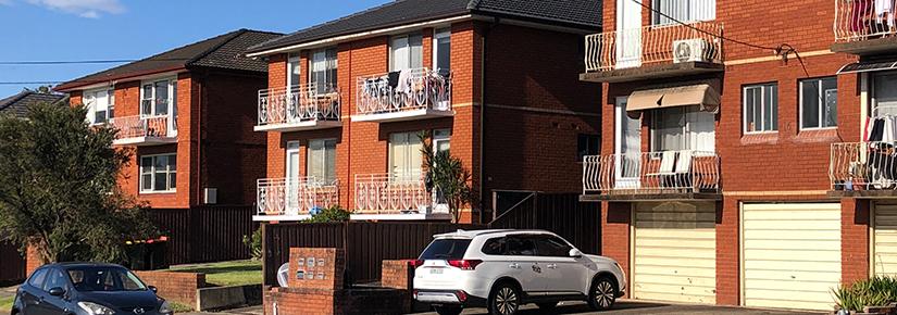 A line of 1960s red brick apartment blocks. Photo: Matthew Darmour-Paul, Author provided