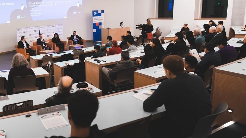 Audience and panel speakers at the event