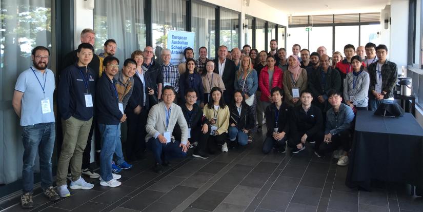 Conference group standing outside a hotel entrance