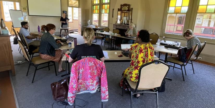 Group of people sitting at desks during a workshop