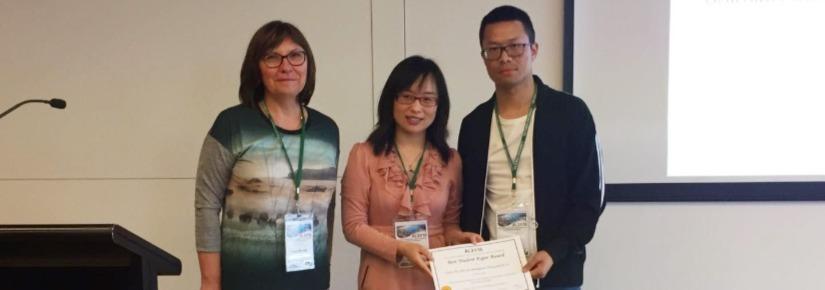 Fujin Zhu (right) with the award presenters Prof Tanja Mitrovic (left) and Dr Bing Xue (middle)