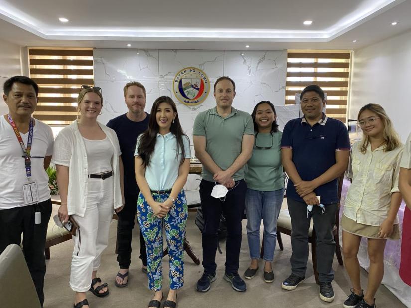 Group of people discussing the value of Coral Reef Restoration to coastal communities in the Philippines