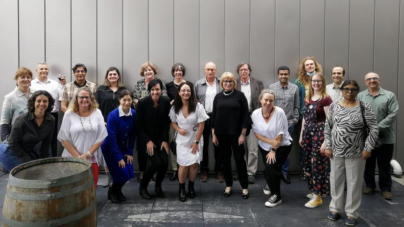 Group of UTS DAB staff standing against a wall