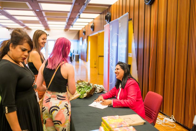 Sarah Malik signing copies of her book 'Desi Girl'.