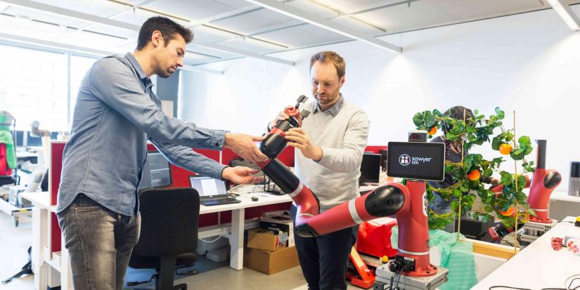 Male researcher with Robotic Arm