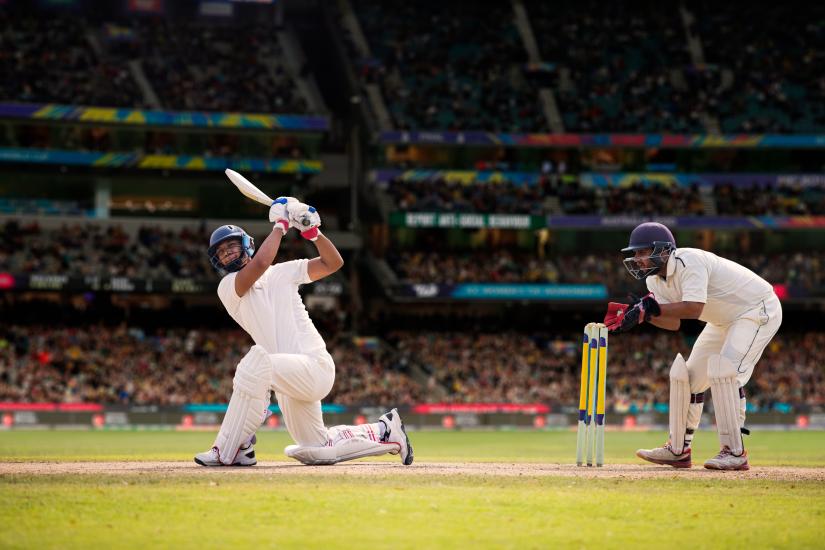 Two cricket players in a stadium