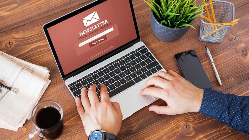 Person viewing newsletter signup page on his laptop screen