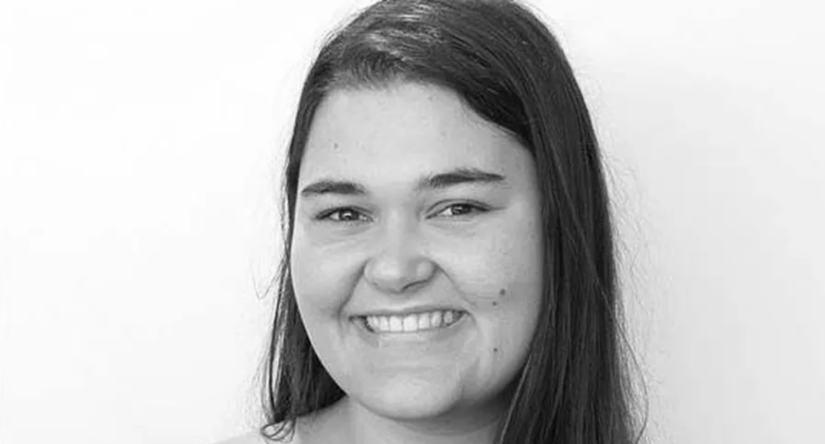 Black and white shot of smiling student's face