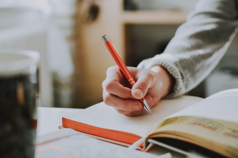 Close up photo of student handwriting in a notebook