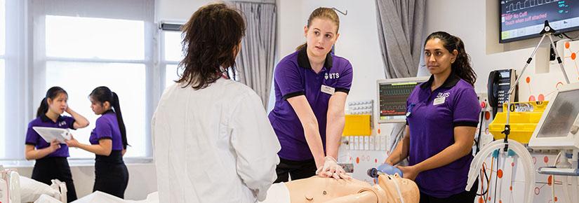 Students learning in a nursing lab