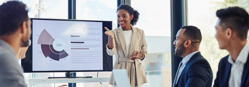 Woman presents a graph to her coworkers