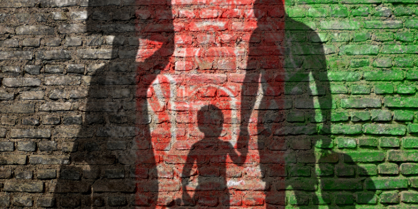 Silhouette of a family carrying their luggage