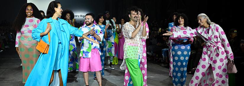 Gary Bigeni surrounded by models wearing his designs at Australian Fashion Week