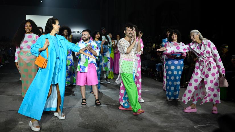 Gary Bigeni surrounded by models wearing his designs at Australian Fashion Week