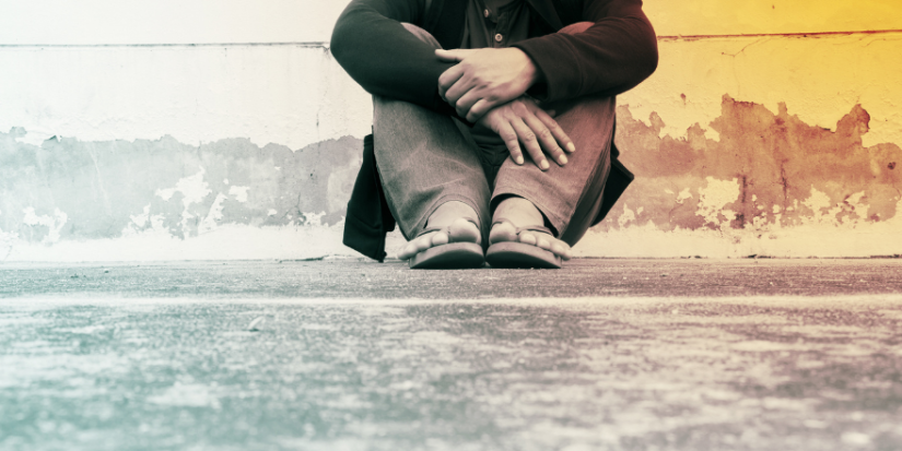 Person sitting on the road