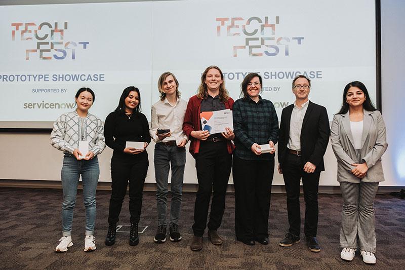 Winning team for best prototype accepts their award.