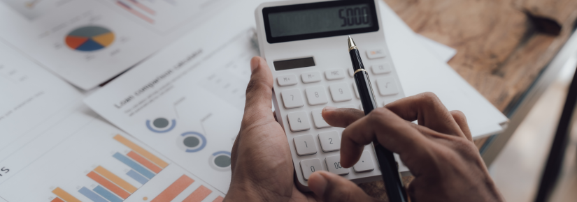 A man using a calculator 