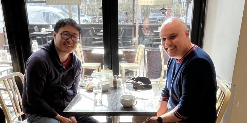 Matthew Salesses and Graham Akhurst sitting at a cafe