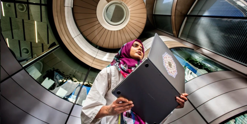 Wajiha holds a computer