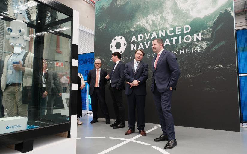 Malcolm Turnbull and Ed Husic with the founders of Advanced Navigation as they stand near an underwater drone display.