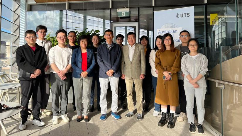 Group shot of AAII researchers with Dr Peijun Guo, guest speaker. Standing in winter garden in UTS's CB02.12.