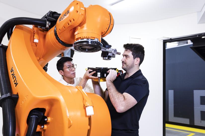 Clyde Webster with a robotic prototype