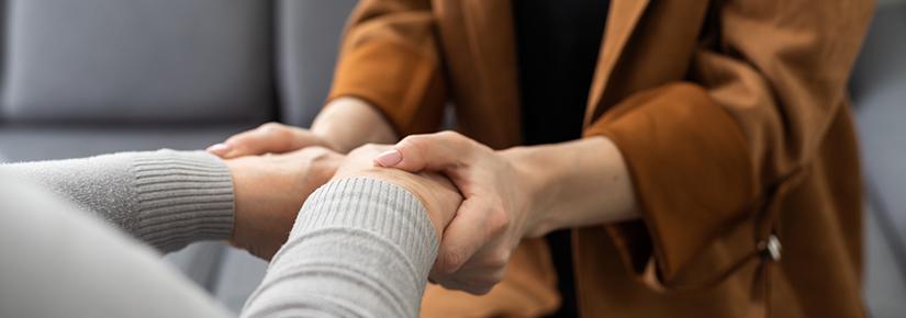 Two people holding hands