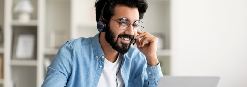 Smiling Man In Headset Study With Laptop At Home