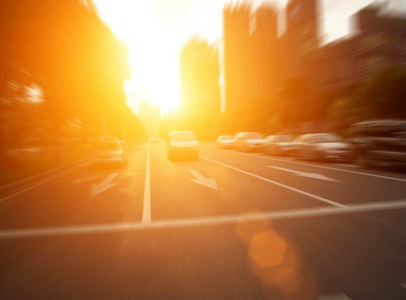 Stock picture of bright sun beating down of a city street