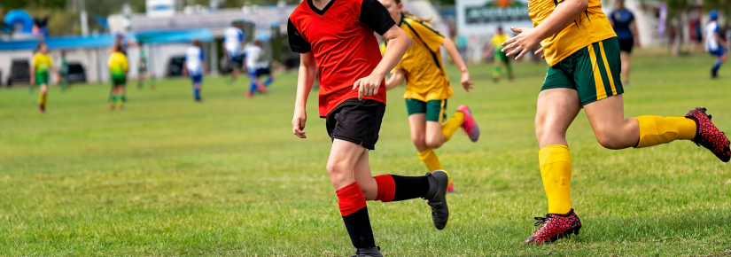 Close up of children playing football