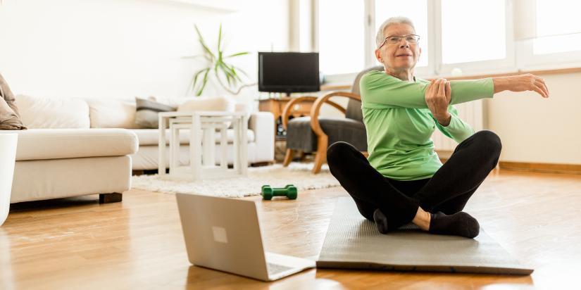 Woman sitting on yoga mat