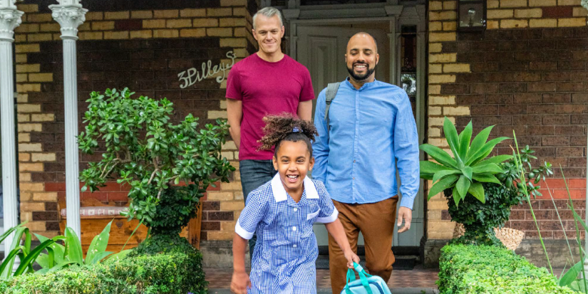 Daughter leaving for School from front of house infront of her parents