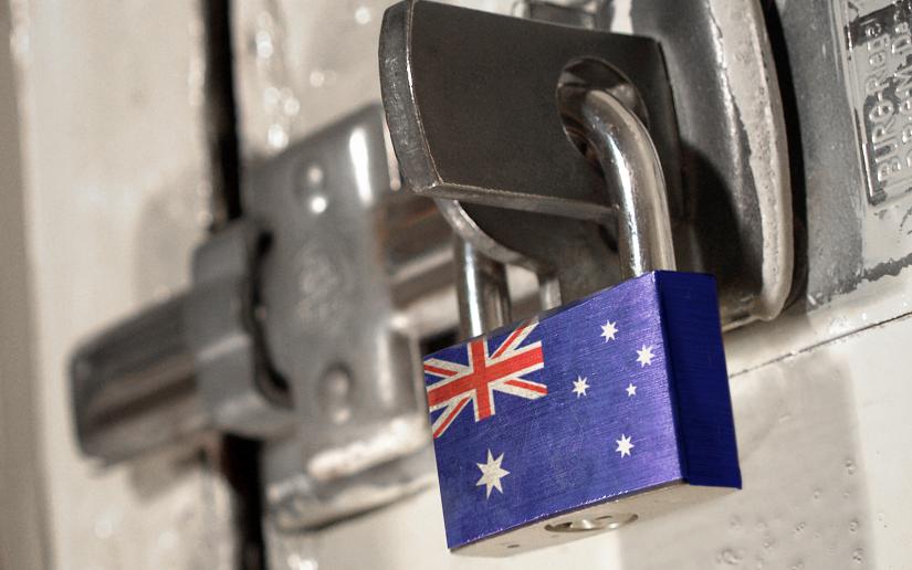 Stock picture of a padlocked door with the Australian national flag on the padlock