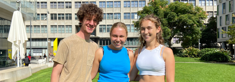 Three students on the Alumni Green