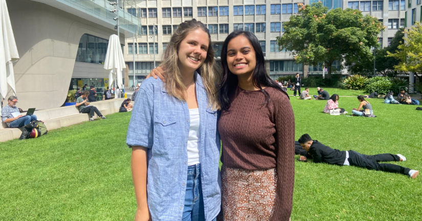 Two female students on the Alumni Green