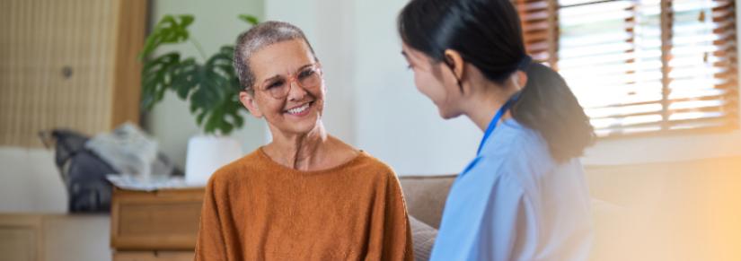 Caregiver holding hands with patient. Adobe Stock