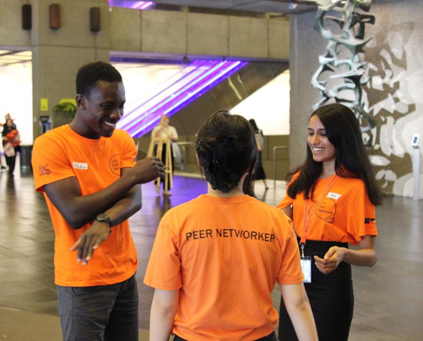 Three Peer Networkers laughing together during Orientation. 