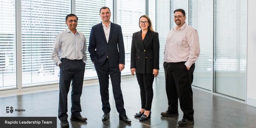 Four members of the UTS Rapido leadership team standing in a line looking at the camera