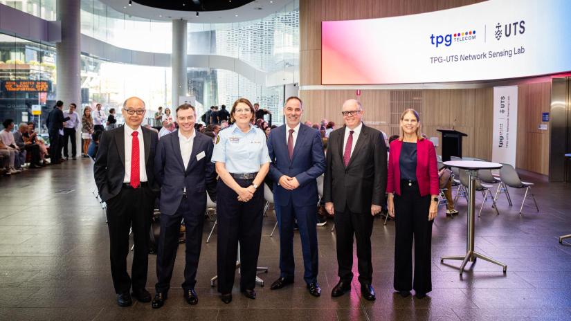 Distinguished Professor Jay Guo, TPG Telecom Chief Technology Officer Giovanni Chiarelli, NSW SES Commissioner Carlene York, Minister for Customer Service and Digital Government Jihad Dib, UTS Vice-Chancellor Professor Andrew Parfitt and Dean of the UTS Faculty of Engineering and Information Technology Peta Wyeth stand and smile at the UTS and TPG launch.