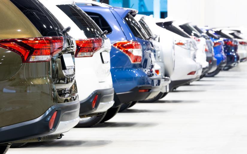 New cars lined up in a showroom.