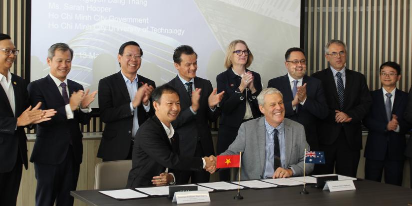 A group of dignitaries signing the UTS Ho Chi Min University of Technology research agreement