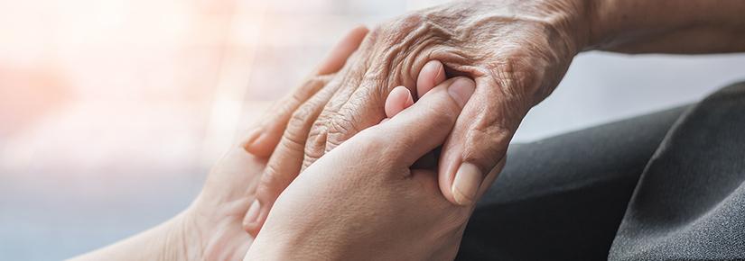 Two people holding hands