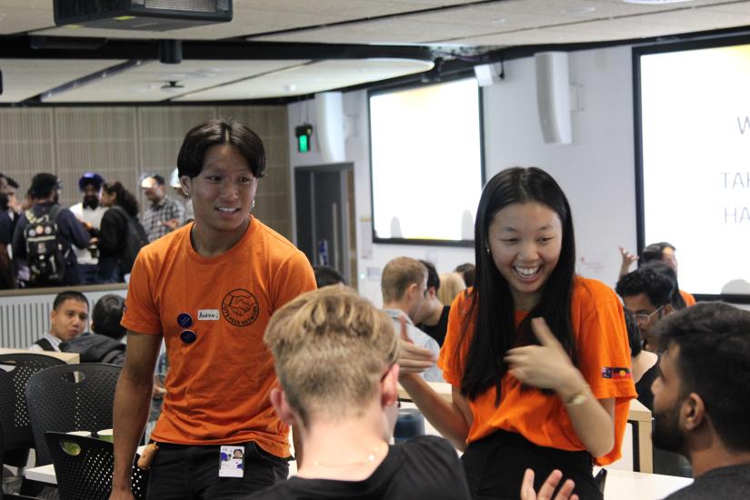 Peer Network volunteers smiling and chatting to students