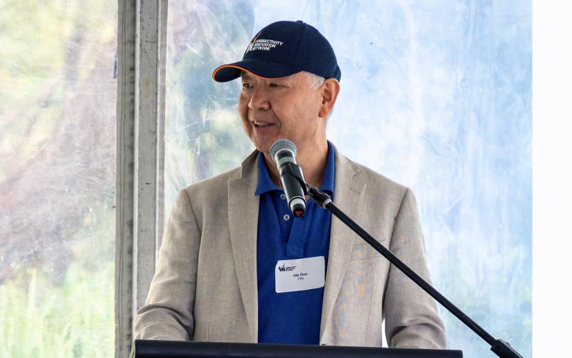 Distinguished Professor Jay Guo speaks during the public demonstration of the large-area Wi-Fi system in the Royal National Park in February.