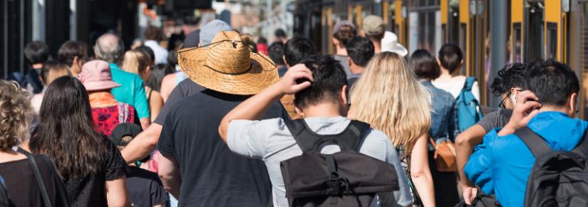 crowd near a train. Adobe Stock