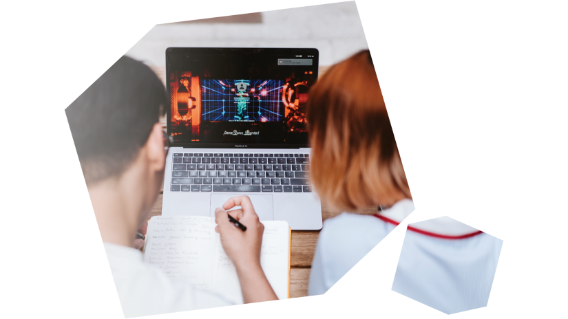 Animation students collaborate on laptop