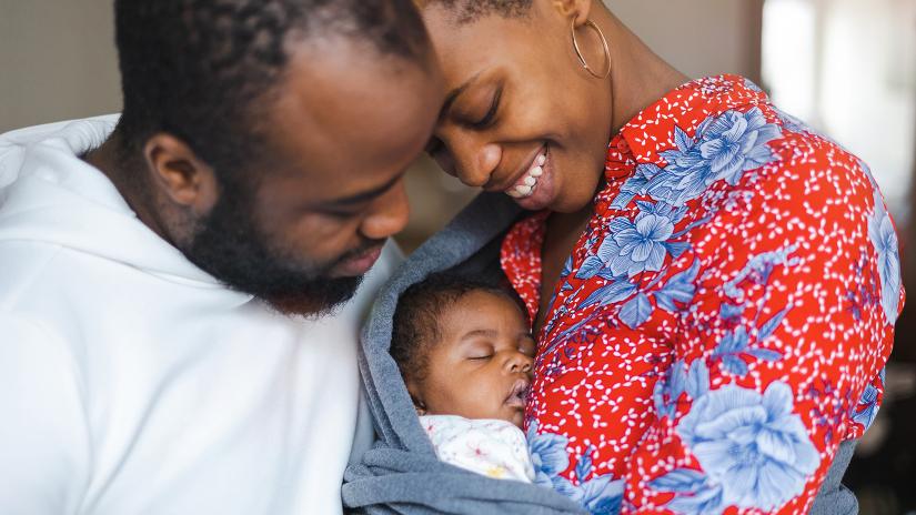 Parents holding their newborn baby