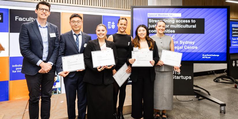 The team hold their certificates