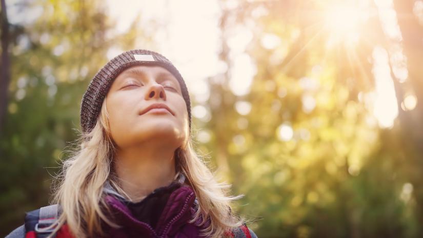 Young woman enjoying a walk in nature