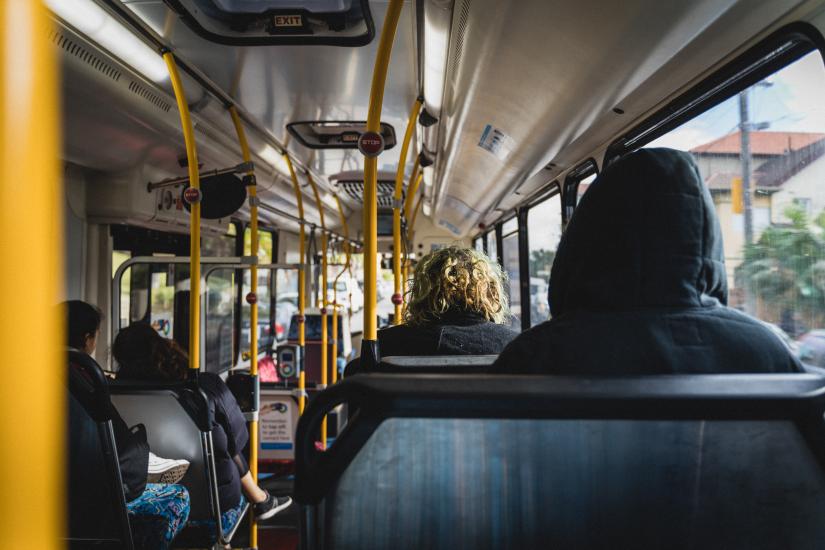 View from the back of passengers travelling on a Sydney bus 